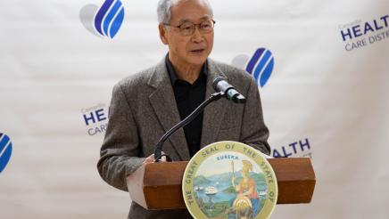 Man at podium, speaking