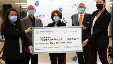 Group photo with big check