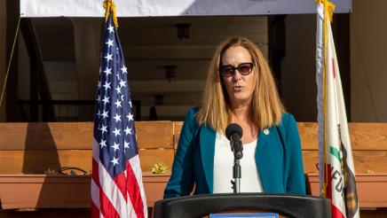 Asm. Irwin at podium, speaking