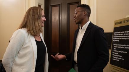 Asm. Irwin speaking with Chidi Agu