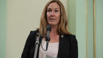 Asm. Irwin at microphone, speaking
