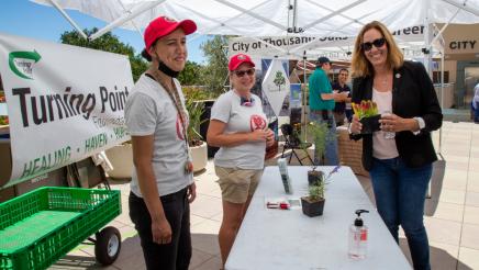 Asm. Irwin shares a light moment with staffers of the Turning Point booth