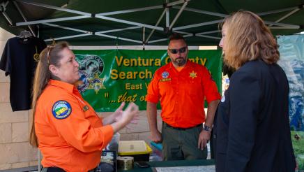 Asm. Irwin speaking with Ventura County Search and Rescue booth staffers