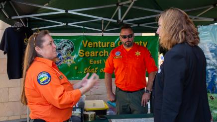 Asm. Irwin speaking with Ventura County Search and Rescue booth staffers