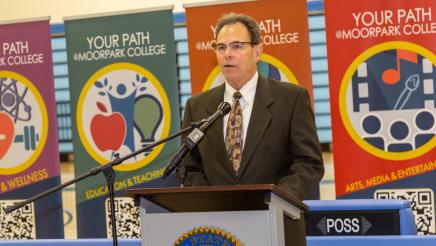 Ventura County Community Colleges Chancellor Dr. Rick MacLennan at podium, speaking