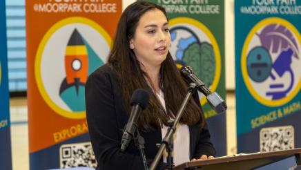 The Education Trust-West Associate Dir. of Policy & Govt Relations Melissa Bardo at podium, speaking