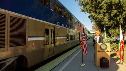 Asm. Irwin pauses as a train passes by