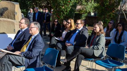 Audience in attendance listening on