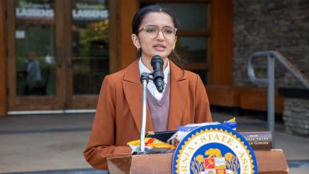 Gracyna Mohabir at podium, speaking