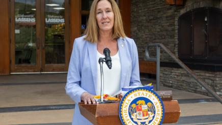 Asm. Irwin at podium, speaking