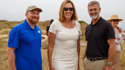 Asm. Irwin posing with two attendees