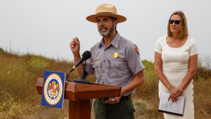 David Szymanski of the National Park Service at podium, speaking