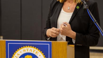 Asm. Irwin at podium, speaking