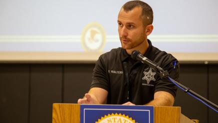Deputy sheriff at podium, speaking