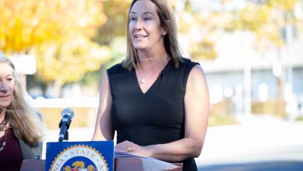 Asm. Irwin at podium, speaking