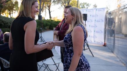 Asm. Irwin greeting a ceremony attendee