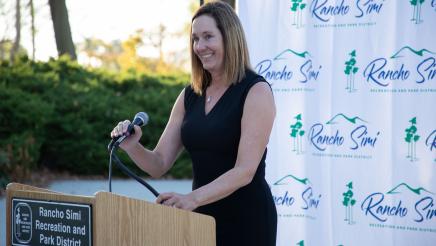 Asm. Irwin stepping up to podium to address attendees