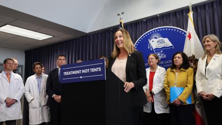 Assemblymember Irwin at the podium of Governor’s press conference on mental health reform 
