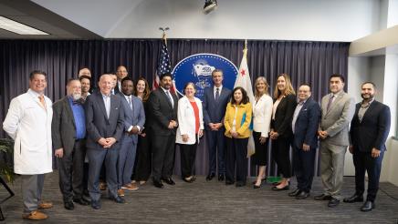 Attendees pose for a photo at Governor Newsom’s press conference on mental health reform, including Governor Gavin Newsom, Assemblymember Jacqui Irwin, Sacramento Mayor Darrell Steinberg, and others