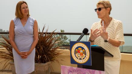 Asm. Irwin listens on as honoree speaks at podium