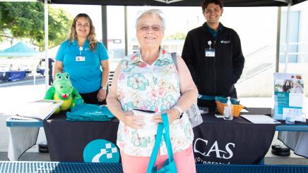 Clinicas staffers with happy constituent
