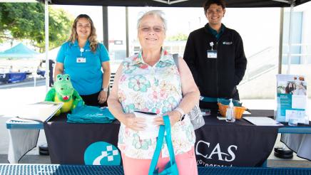 Clinicas staffers with happy constituent