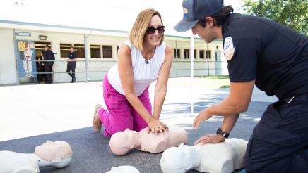 Asm. Irwin being given CPR lesson