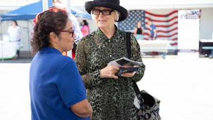 Constituent conversing with table staffer