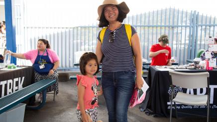 Mother standing with small child