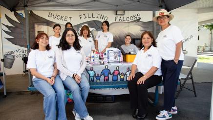 Multiple Westminster Free Clinic staffers gathered around table