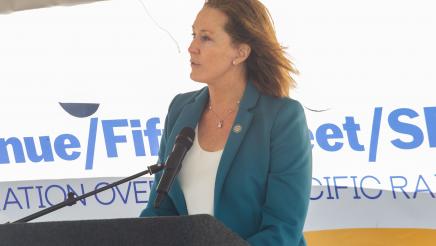 Asm Irwin at podium, speaking