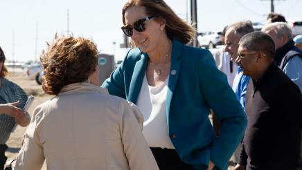 Asm. Irwin speaking with ceremony participant
