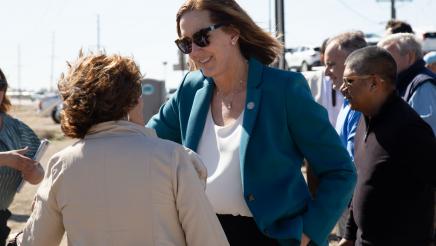 Asm. Irwin speaking with ceremony participant