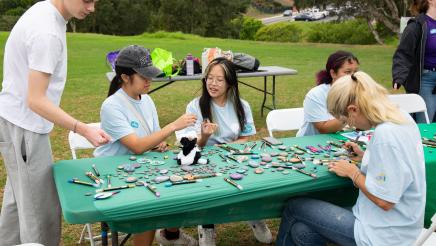 Volunteers working at craft table