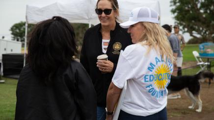 Asm. Irwin speaking with two attendees
