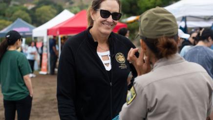 Asm. Irwin speaking with attendee