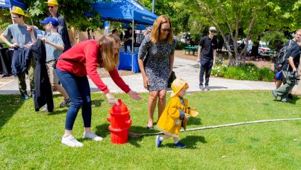 Small child learns about firefighting