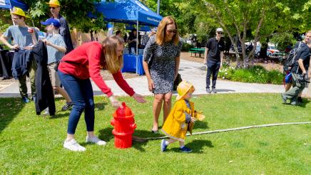 Small child learns about firefighting