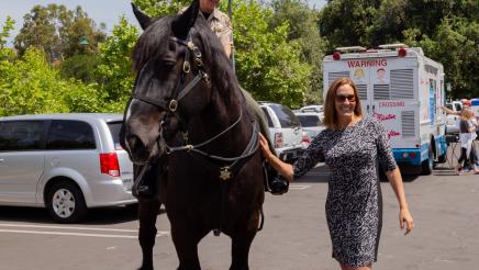 Asm. Irwin with officer on horseback