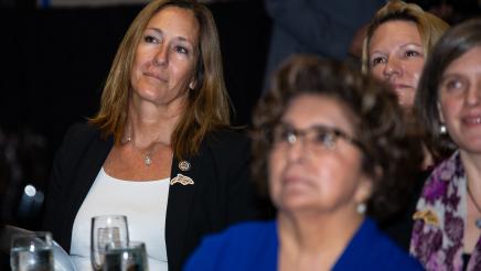 Asm. Irwin and audience listen on